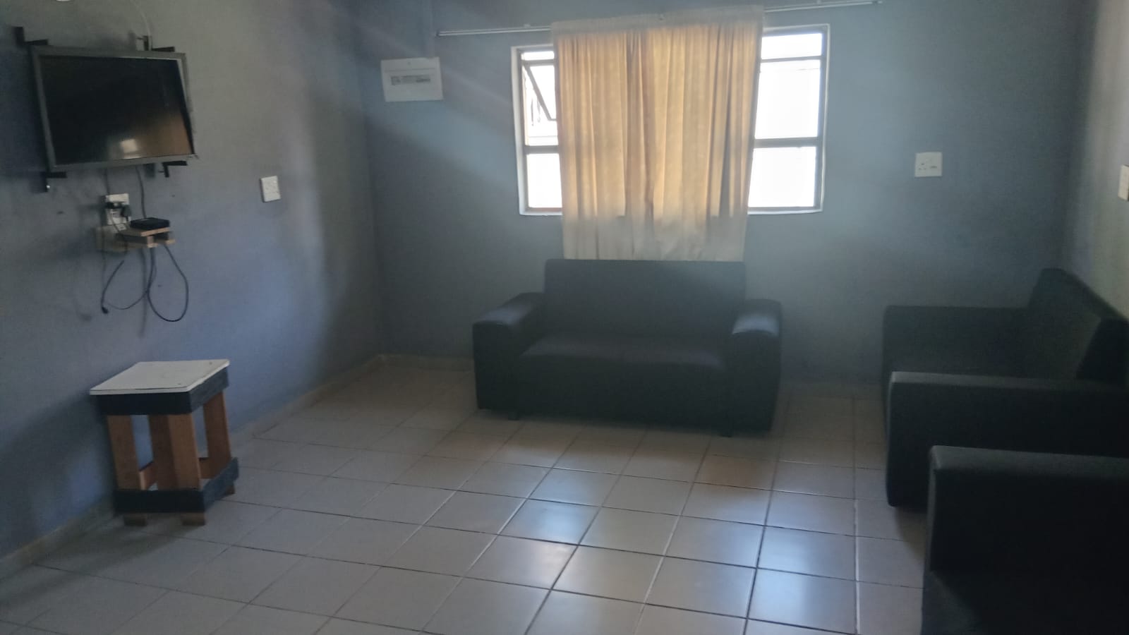Shared lounge with seating and television